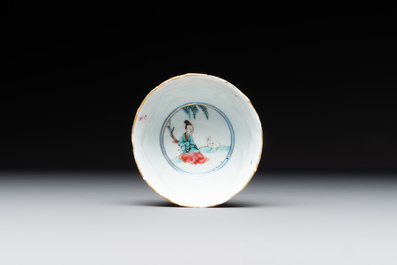 A Chinese famille rose cup and saucer with figures and animals, Yongzheng