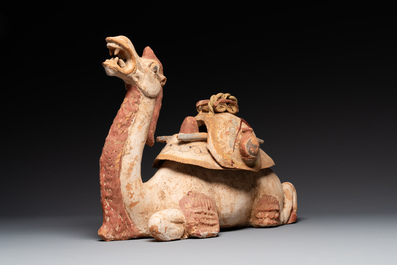 A pair of Chinese polychrome-painted terracotta camels with saddles, Tang