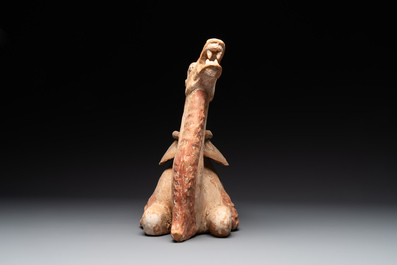 A pair of Chinese polychrome-painted terracotta camels with saddles, Tang