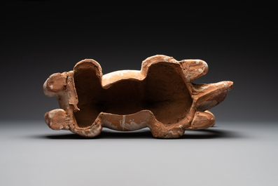 A pair of Chinese polychrome-painted terracotta camels with saddles, Tang