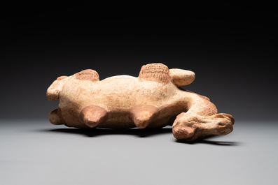 A pair of Chinese polychrome-painted terracotta camels with saddles, Tang