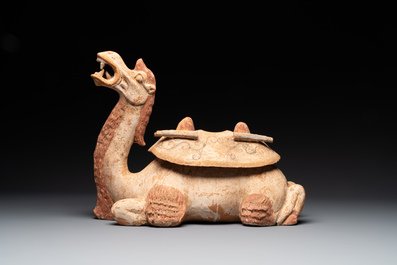 A pair of Chinese polychrome-painted terracotta camels with saddles, Tang