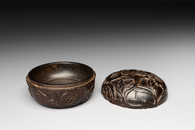 A Chinese huanghuali wooden box and cover with pomegranate design, 17/18th C.