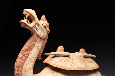 A pair of Chinese polychrome-painted terracotta camels with saddles, Tang