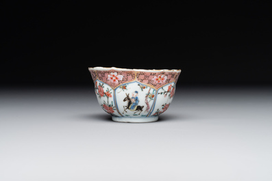 A Chinese famille rose cup and saucer with figures and animals, Yongzheng