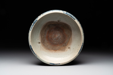 A Chinese Swatow blue and white crackle-glazed 'peonies and trigrams' tripod censer, Ming