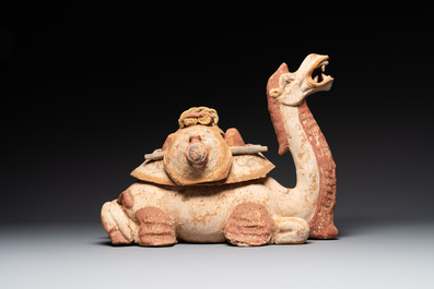 A pair of Chinese polychrome-painted terracotta camels with saddles, Tang