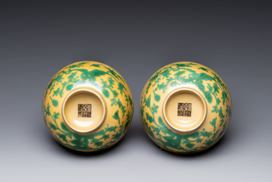 A pair of Chinese yellow-ground 'peach and bird' bowls, Qianlong mark and probably of the period