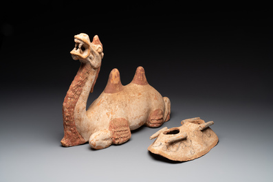 A pair of Chinese polychrome-painted terracotta camels with saddles, Tang
