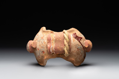 A pair of Chinese polychrome-painted terracotta camels with saddles, Tang