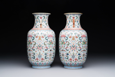 A pair of Chinese famille rose vases with floral design, Jiaqing mark, 19/20th C.