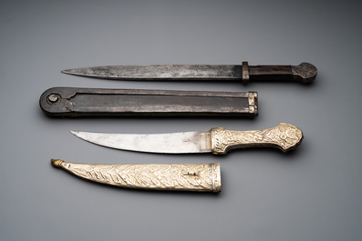 A varied collection of four decorated daggers, two inset with red coral and turquoise, Sri Lanka and Georgia, 18/19th C.