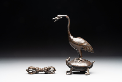 A Chinese bronze candle or incense holder in the shape of a crane standing on a turtle and a Tibetan vajra, Ming/Qing