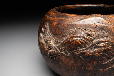 A Chinese agarwood brush washer with landscape relief design on wooden stand, 17/18th C.