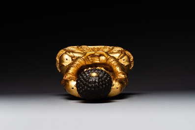 A large Sino-Tibetan gilt bronze Buddha on wooden stand, Ming