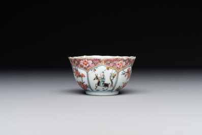 A Chinese famille rose cup and saucer with figures and animals, Yongzheng