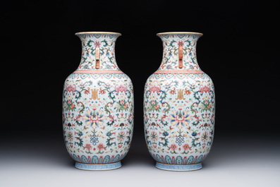A pair of Chinese famille rose vases with floral design, Jiaqing mark, 19/20th C.