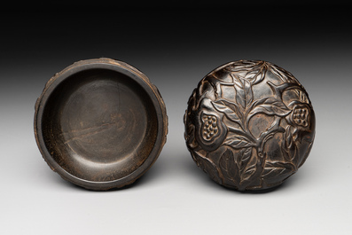 A Chinese huanghuali wooden box and cover with pomegranate design, 17/18th C.
