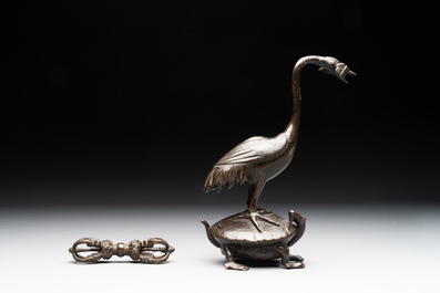 A Chinese bronze candle or incense holder in the shape of a crane standing on a turtle and a Tibetan vajra, Ming/Qing