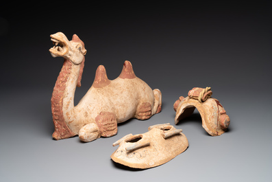 A pair of Chinese polychrome-painted terracotta camels with saddles, Tang