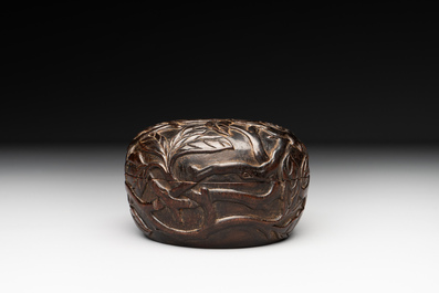 A Chinese huanghuali wooden box and cover with pomegranate design, 17/18th C.