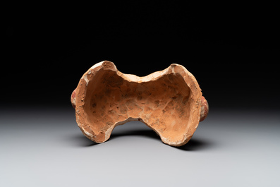 A pair of Chinese polychrome-painted terracotta camels with saddles, Tang