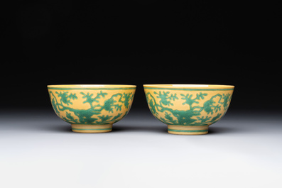 A pair of Chinese yellow-ground 'peach and bird' bowls, Qianlong mark and probably of the period