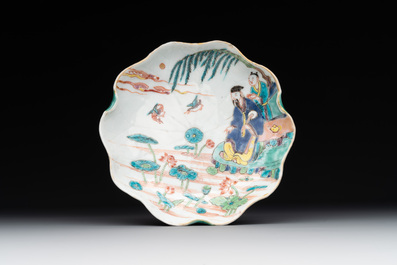 A Chinese famille rose relief-decorated 'lotus' cup and saucer, Yongzheng