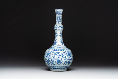 A Chinese blue and white 'lotus scroll' bottle vase, Transitional period