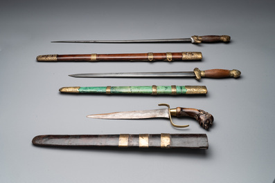 A silver plated dagger and four swords, China, Burma and Indonesia, 18/19th C.