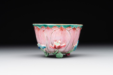 A Chinese famille rose relief-decorated 'lotus' cup and saucer, Yongzheng