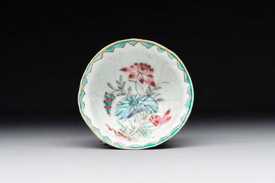 A Chinese famille rose relief-decorated 'lotus' cup and saucer, Yongzheng