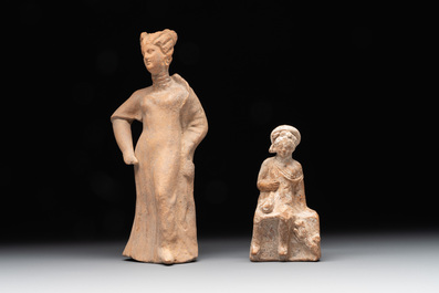 Two terracotta female figures and two fragments with figural design, Italy, 7/4th C. B.C.