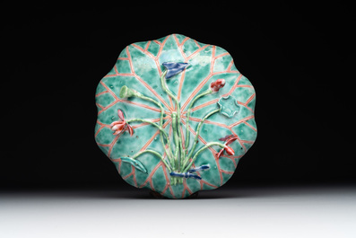 A Chinese famille rose relief-decorated 'lotus' cup and saucer, Yongzheng