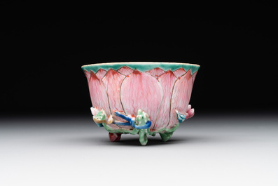 A Chinese famille rose relief-decorated 'lotus' cup and saucer, Yongzheng