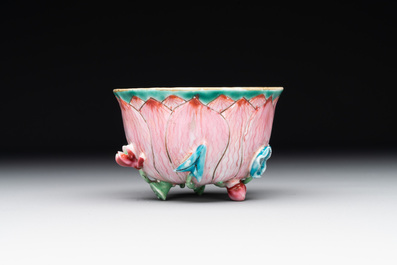 A Chinese famille rose relief-decorated 'lotus' cup and saucer, Yongzheng