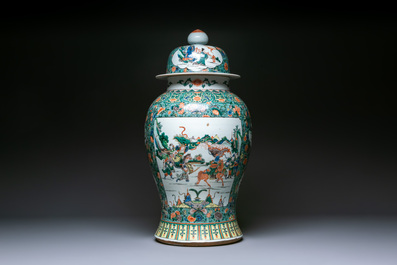 A large Chinese famille verte 'warriors on horseback' vase and cover, 19th C.