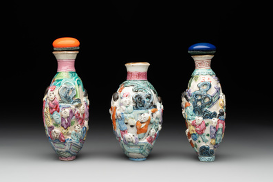 Six Chinese moulded famille rose snuff bottles, Qianlong mark, 19th C.