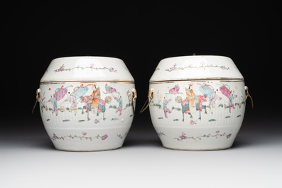 A pair of Chinese famille rose jars and covers with figures in a garden, Tongzhi mark and of the period