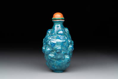 A rare Chinese robin's-egg-glazed moulded '18 Luohan' snuff bottle, 19th C.