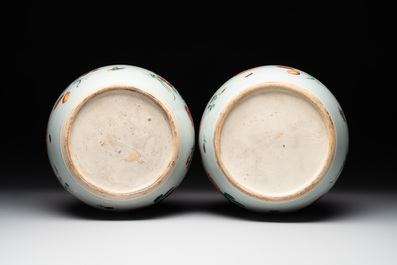 A pair of fine Chinese famille rose 'botanical Merian-style' jars with wooden covers, Qianlong