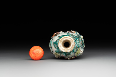 A Chinese famille rose moulded snuff bottle, Qianlong mark, late 18th/early 19th C.
