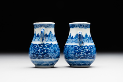 A pair of Chinese blue and white miniature 'hu' vases on wooden stands, Kangxi mark, 19th C.