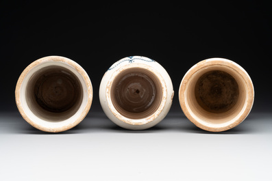 Three large blue and white pottery albarelli, Spain, 17th C.