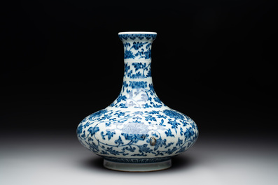 A Chinese blue and white 'lotus scroll' bottle vase, 18/19th C.