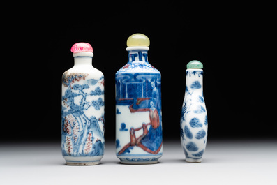 Two Chinese blue, white and copper-red snuff bottles and a blue and white 'crab' snuff bottle, Chenghua and Qianlong mark, 19th C.