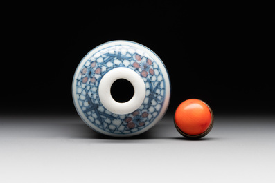 A Chinese blue, white and copper-red snuff bottle, Kangxi mark, 19th C.