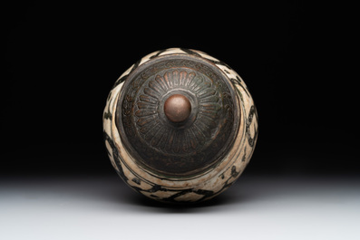 An early Islamic pottery albarello with engraved copper mount and cover, probably Nishapur, Iran, 10/11th C.