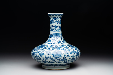 A Chinese blue and white 'lotus scroll' bottle vase, 18/19th C.