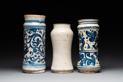 Three large blue and white pottery albarelli, Spain, 17th C.